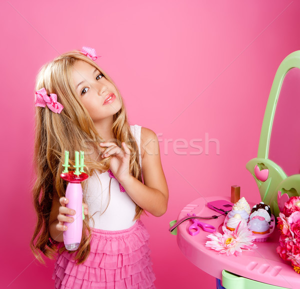 Stock photo: hairdresser blond fashion doll girl with hair curler
