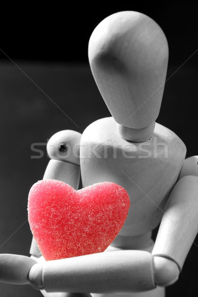 Wooden mannequin holding a red jelly  heart shape Stock photo © lunamarina