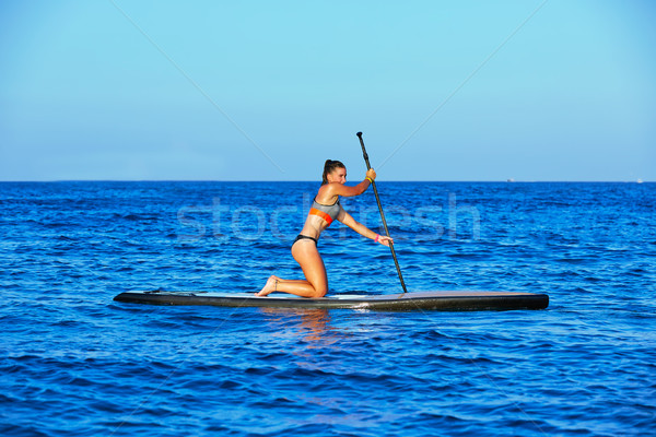 Stock photo: SUP Stand up Surf girl with paddle