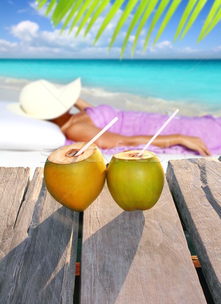 coconuts woman sun tanning topical beach Stock photo © lunamarina