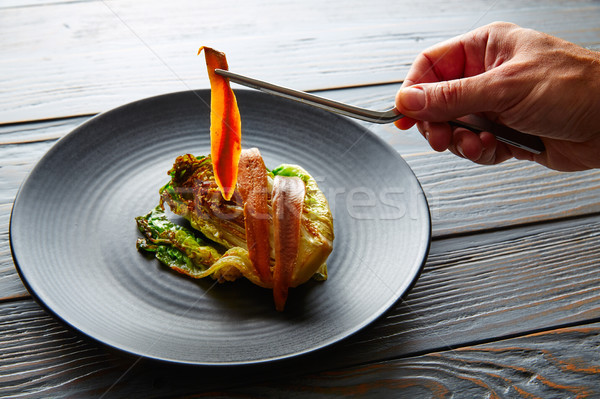 Cantabrian anchovies with endive chef hand Stock photo © lunamarina