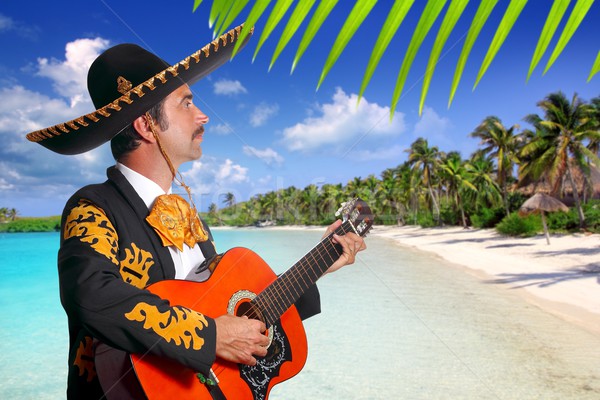 Charro mexican Mariachi playing guitar in beach Stock photo © lunamarina