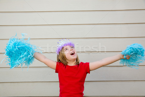 Blond kid girl playing like cheerleading pom poms and crown Stock photo © lunamarina