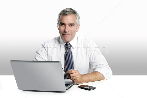 üzletember idős ősz haj dolgozik laptop laptop számítógép Stock fotó © lunamarina