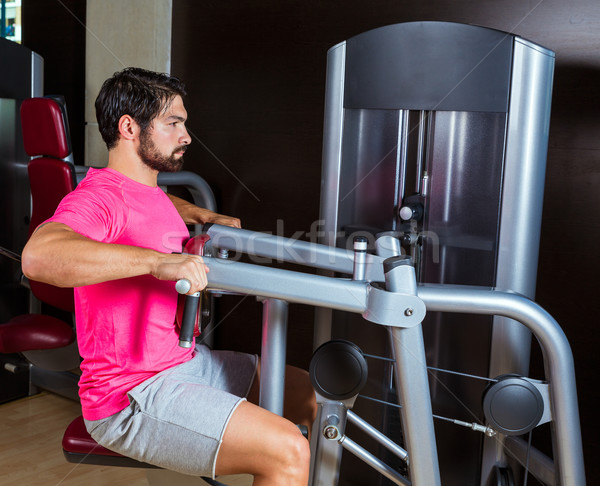 Stock photo: Seated back row machine man workout at gym