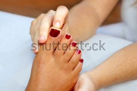 Reflexology woman feet massage therapy Stock photo © lunamarina