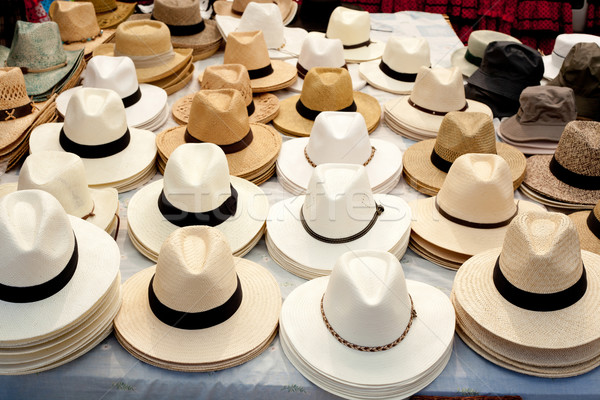 beige and white straw hats in a row Stock photo © lunamarina