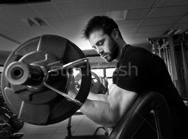 biceps preacher bench arm curl workout man at gym Stock photo © lunamarina