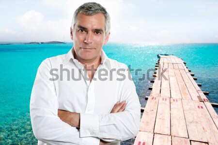 beach vacation man looking the sea blue shirt Stock photo © lunamarina