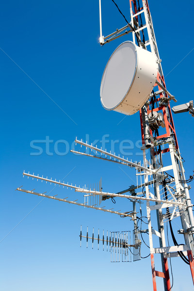 Antenna repeater messy mast in blue sky Stock photo © lunamarina