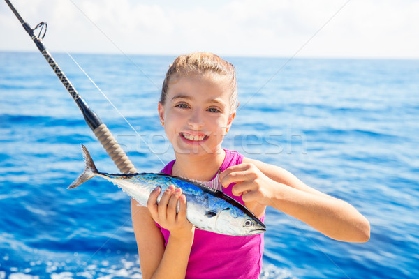 Kid girl fishing tuna little tunny happy with fish catch Stock photo © lunamarina