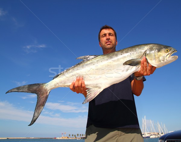 Stock fotó: Halász · tart · zsákmány · tengerpart · víz · férfi