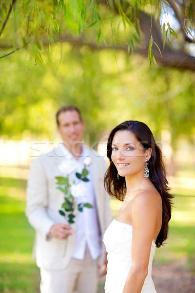 Pár friss házasok férfi tart virágok kéz Stock fotó © lunamarina