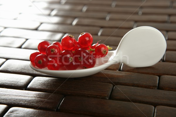 Redcurrant berries in a white spoon Stock photo © lunamarina