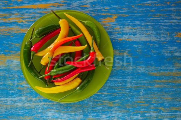 Stock photo: Colorful mexican chili peppers in wood table