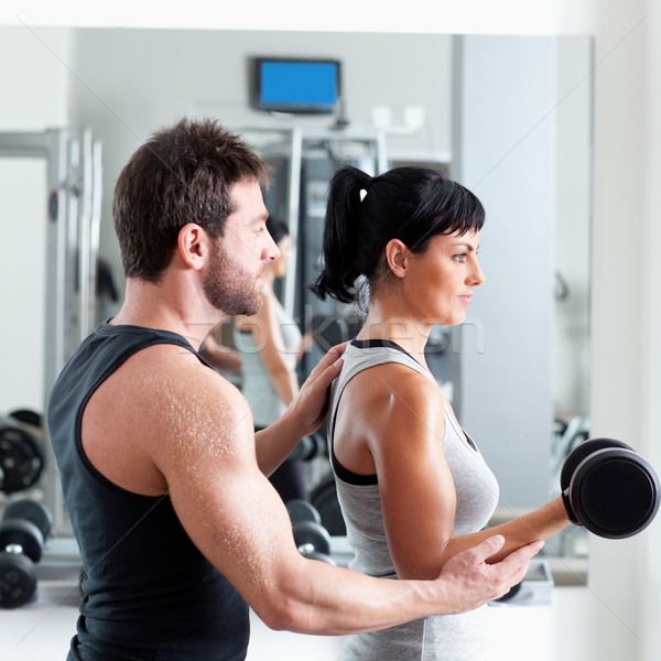 Tornaterem nő személyi edző súlyzós edzés férfi felszerlés Stock fotó © lunamarina