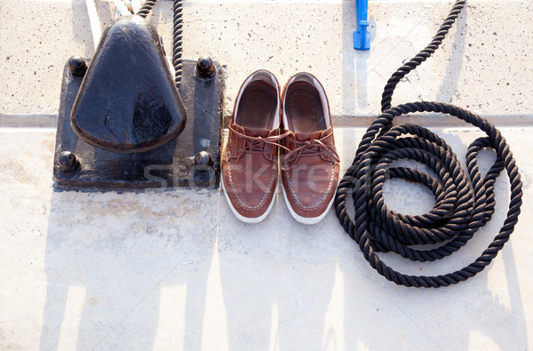 Bollard with nautic shoes and rope coil Stock photo © lunamarina