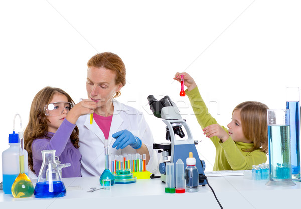 children girlas and teacher woman at school laboratory Stock photo © lunamarina