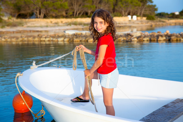 Kid girl pretending to be sailor in boat bow at Formentera Stock photo © lunamarina