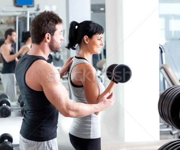 Tornaterem nő személyi edző súlyzós edzés férfi felszerlés Stock fotó © lunamarina