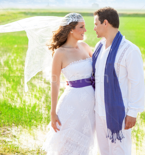Couple in wedding day with wind on veil Stock photo © lunamarina