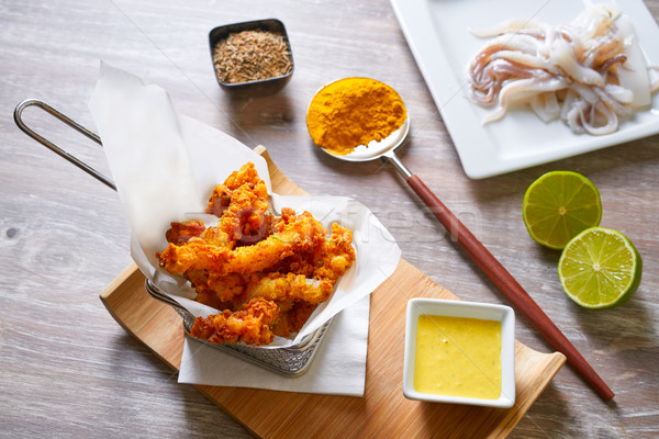 Fried breaded squid and curry sauce and lime Stock photo © lunamarina