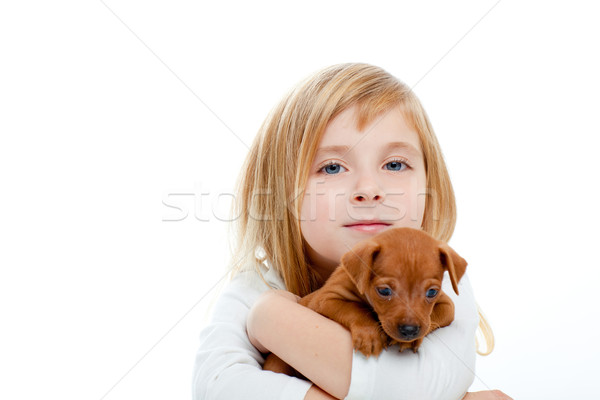 Blond children girl with dog puppy mini pinscher Stock photo © lunamarina