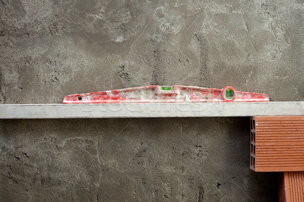 Bolha espírito nível ferramenta vermelho cimento Foto stock © lunamarina