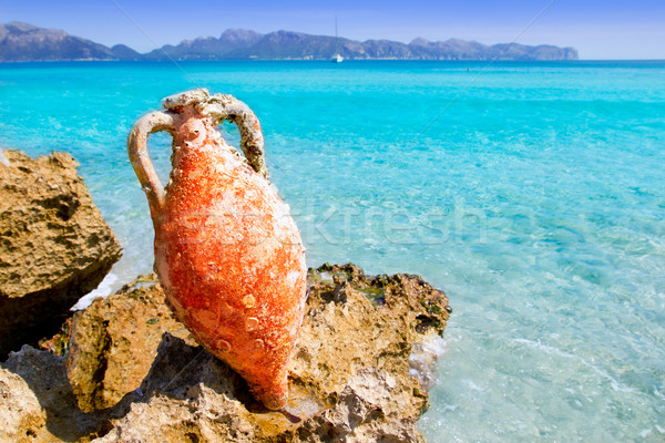 Alcudia Beach Mallorca with roman amphora Stock photo © lunamarina