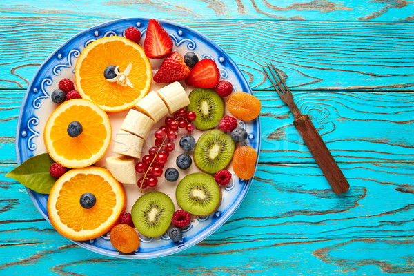 Fruit salad breakfast orange banana kiwi berries Stock photo © lunamarina