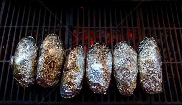 grilled whole potatoes with foil Stock photo © lunamarina