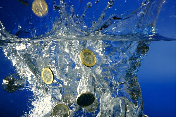 Euro coins fallin down to water Stock photo © lunamarina