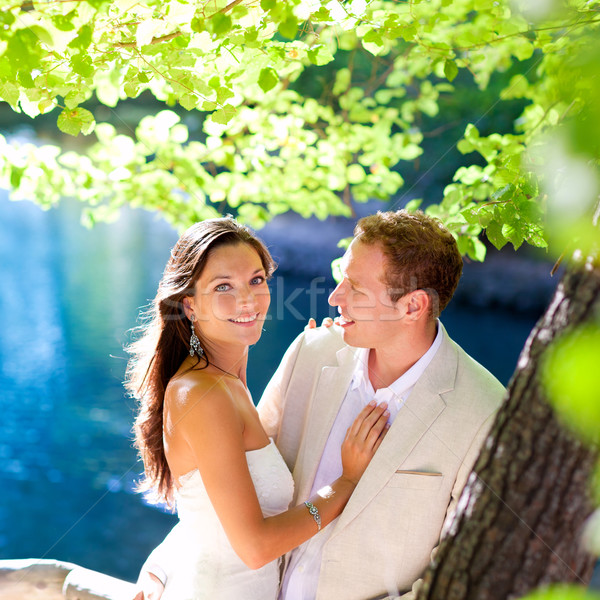 Stock photo: couple in love hug in forest tree blue lake