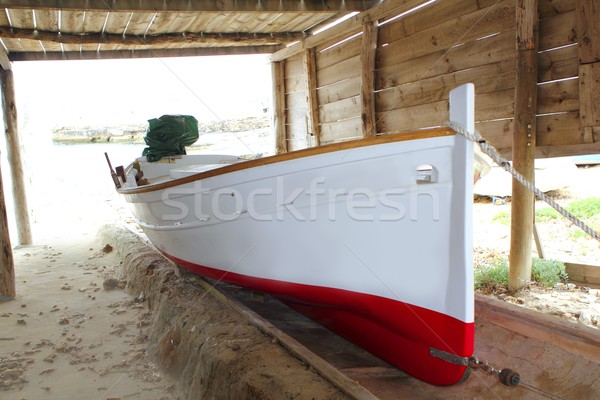 Formentera boat stranded on wooden rails Stock photo © lunamarina