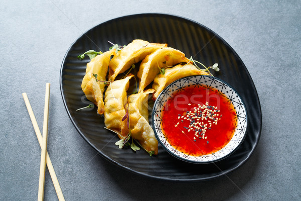 Steamed gyozas teriyaki sauce and sesame Stock photo © lunamarina