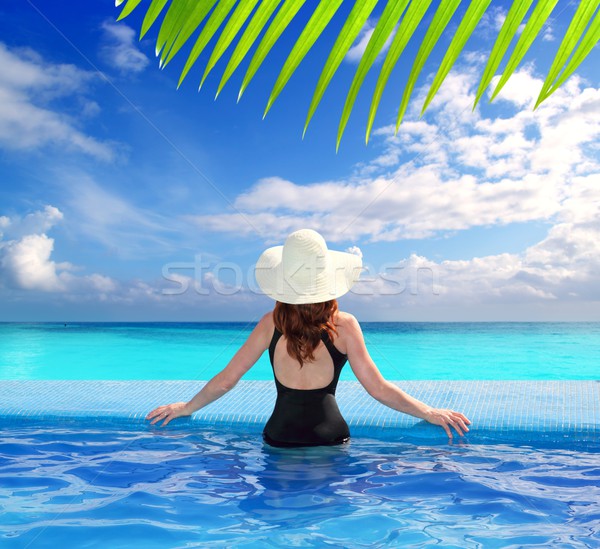 Stock photo: Caribbean sea view from blue pool rear woman