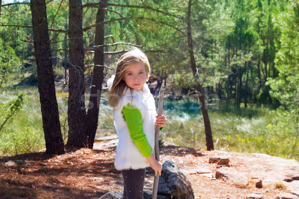 Explorer blond kid girl sith stick and winter white fur Stock photo © lunamarina