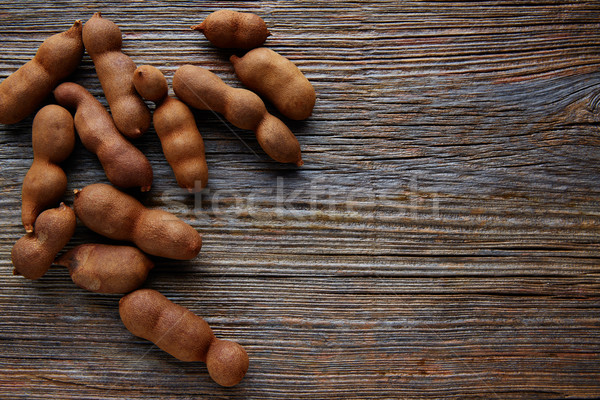 Tamarindo tamarind fruits ripe on brown wood Stock photo © lunamarina