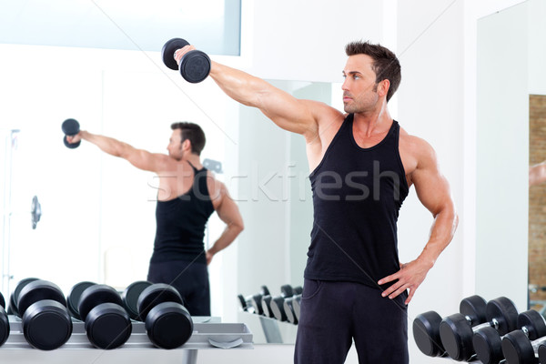 Stock photo:  man with weight training equipment on sport gym