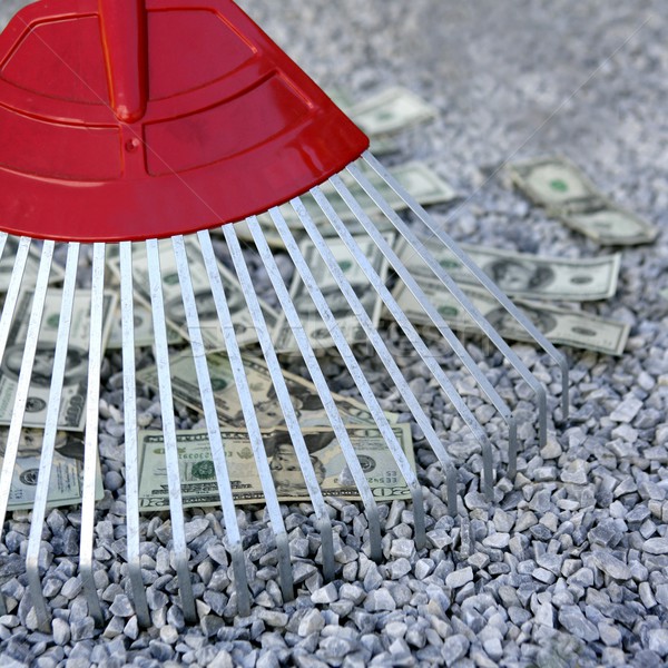 Cleaning black dolar money with rake, metaphor Stock photo © lunamarina