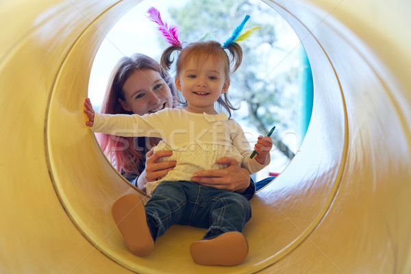 Stock photo: Kid girl and mother playing in the park slider