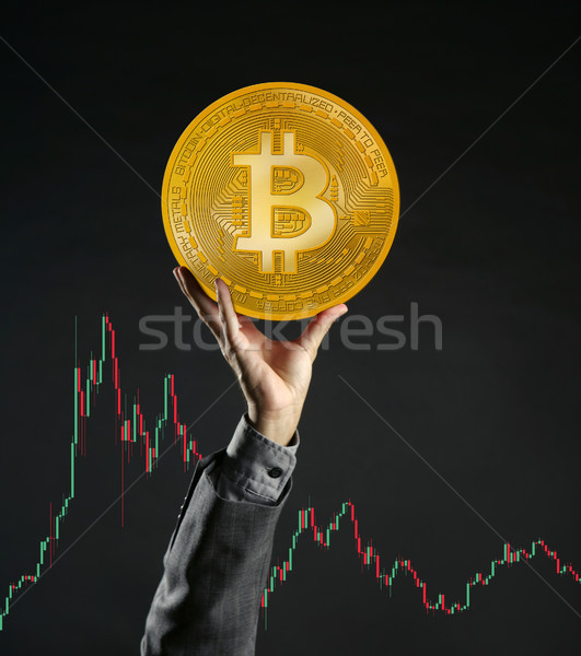 Businessman rising up Bitcoin currency coin Stock photo © lunamarina