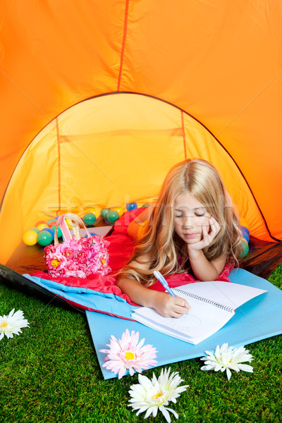 Stock photo: Children girl writing notebook in camping tent with flowers