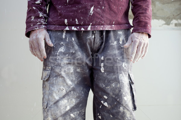 hands dirty trousers of plastering painter man Stock photo © lunamarina