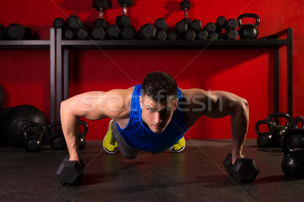 push-up strength man hex dumbbells workout at gym Stock photo © lunamarina