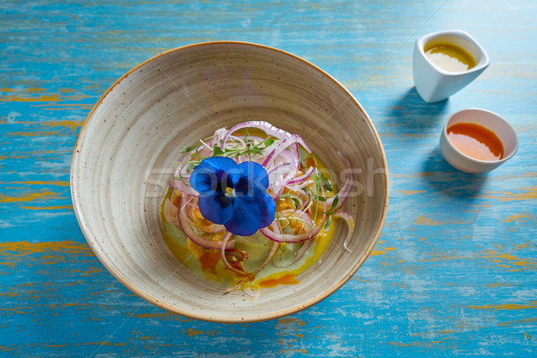 Fish ceviche preuvian recipe and pansy flower Stock photo © lunamarina