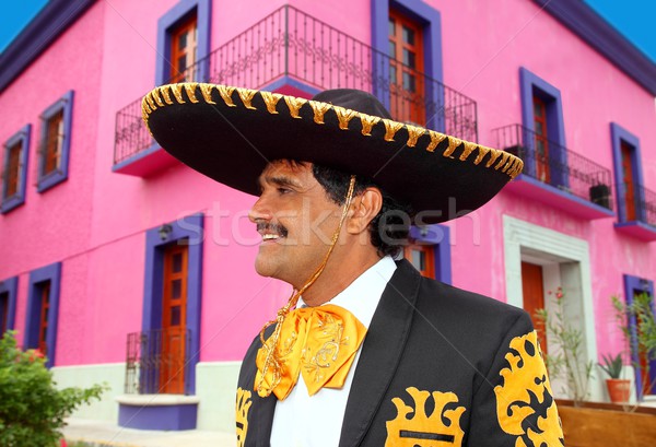 Charro mexican Mariachi portrait in pink house Stock photo © lunamarina