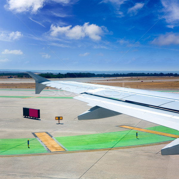 Airplane wing leaving the airport Stock photo © lunamarina