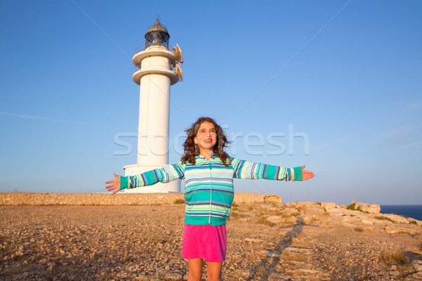 Happy open arms kid girl in Mediterranean lighthouse Stock photo © lunamarina