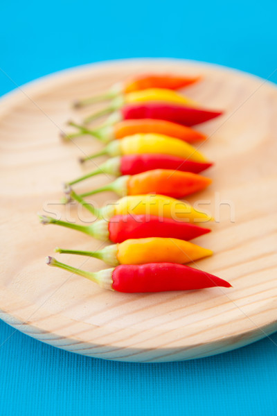 colorful hot chili peppers in a row on plate Stock photo © lunamarina